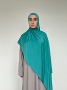 Hijab Jersey Liquid turquoise moyen, effet drapé impeccable.